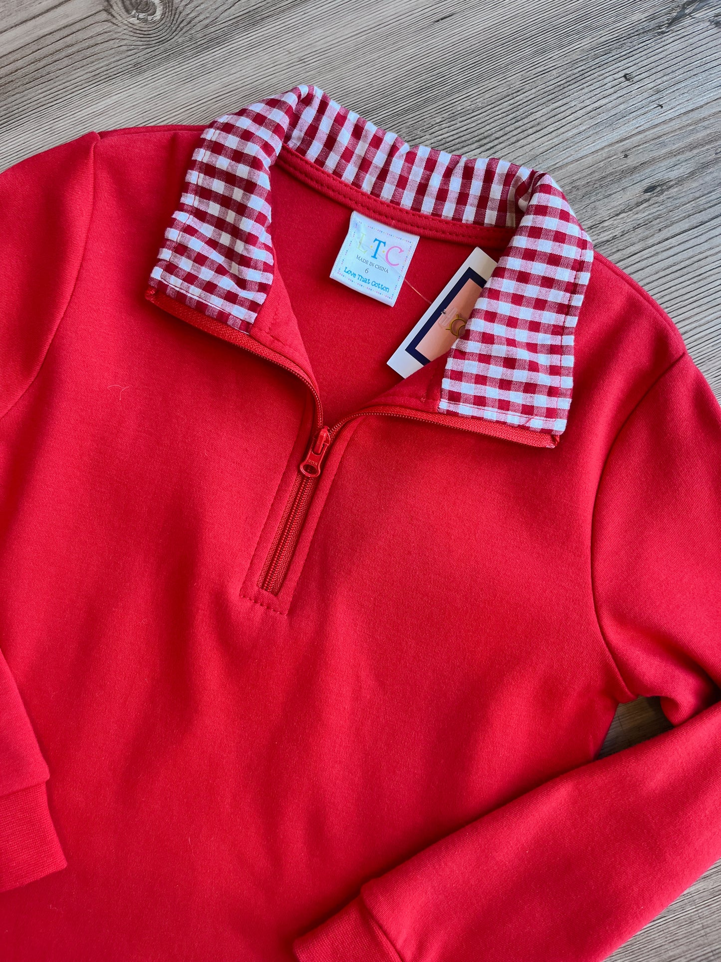 RED PULLOVER WITH RED TRIM